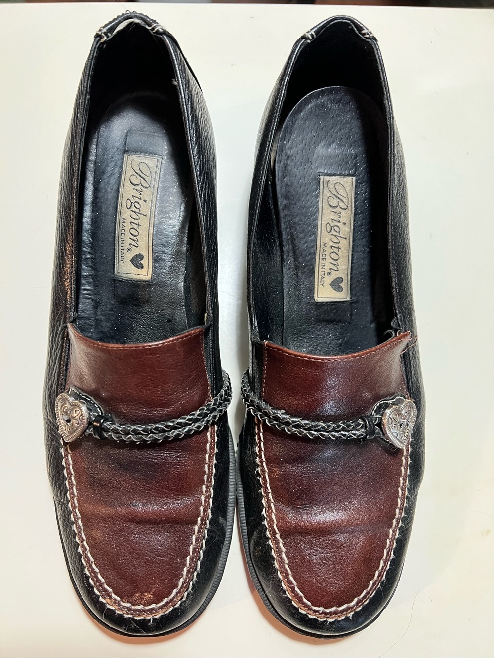 Vintage Brighton Suzy two toned leather loafers with braided strap, heart charm.